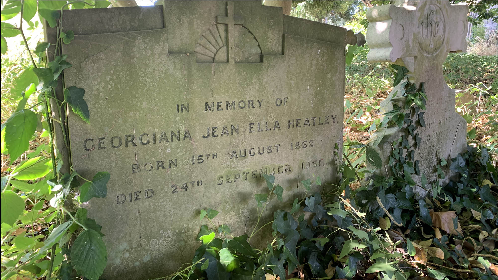 Gravestone with inscription 'in memory of Georgiana Jean Ella Heatley'