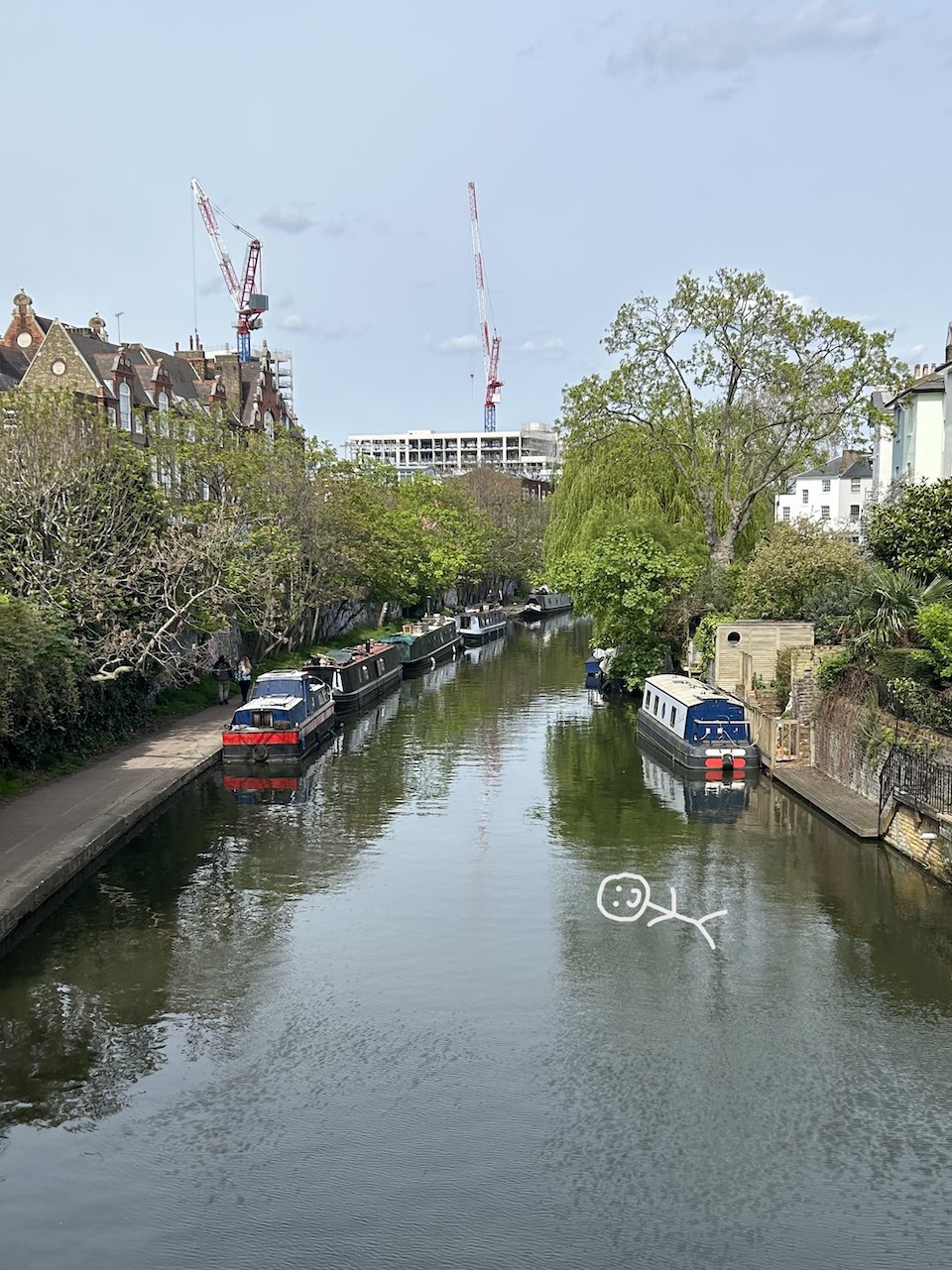 View from above of Regent's Canal, with a stick figure floating in the water